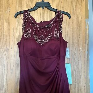 New with tags burgundy dress never worn.